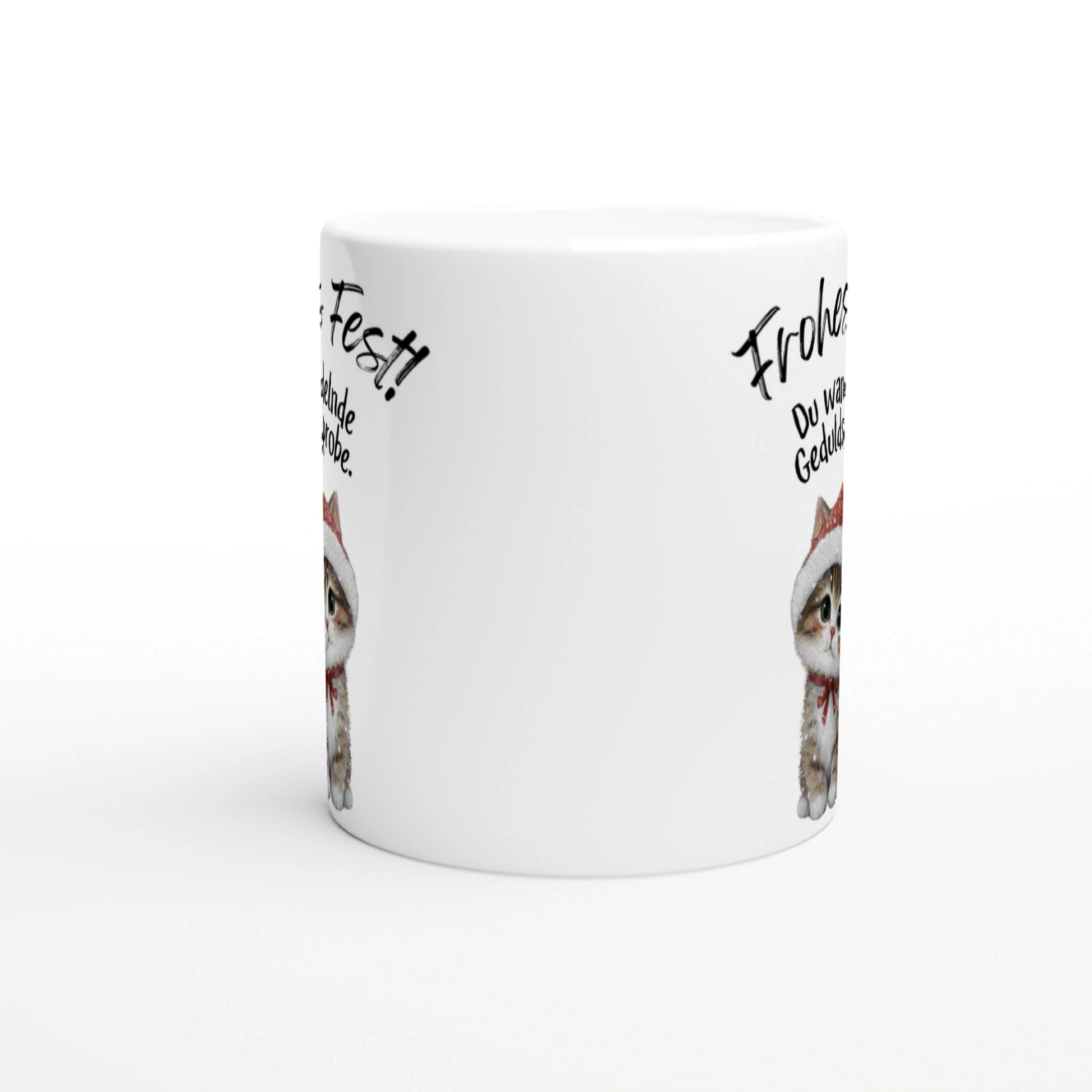 White ceramic mug mockup featuring a cute kitten wearing a Santa hat with handwritten German phrases around the rim.
