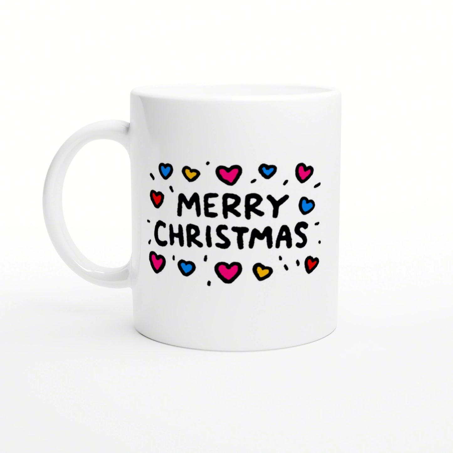 White ceramic mug mockup with 'Merry Christmas' text surrounded by colorful hearts on a white background.