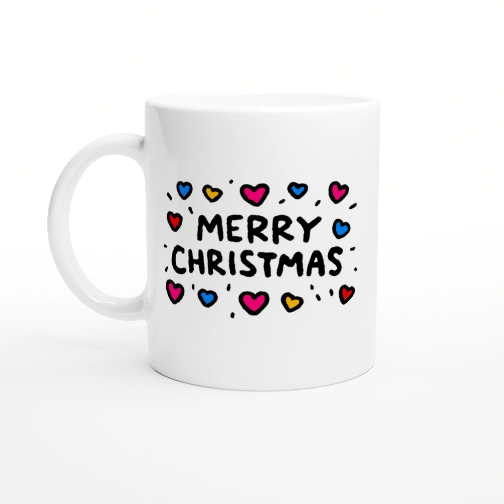White ceramic mug mockup with 'Merry Christmas' text surrounded by colorful hearts on a white background.