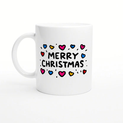 White ceramic mug mockup with 'Merry Christmas' text surrounded by colorful hearts on a white background.
