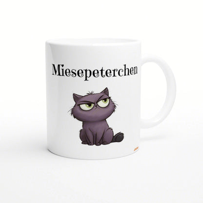 White ceramic mug mockup featuring a purple grumpy cat illustration and the word Miesepeterchen.
