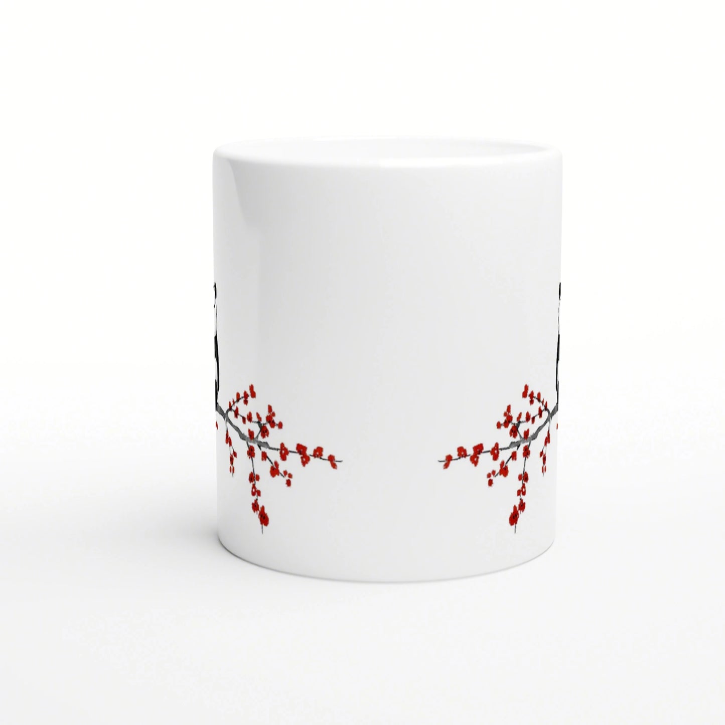 White ceramic mug mockup with red cherry blossom branches along the lower edge.