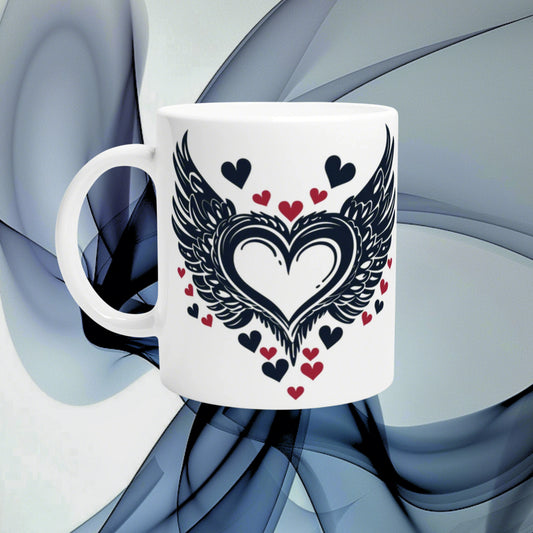White ceramic mug mockup featuring a black winged-heart design with red and black small hearts on an abstract blue background.