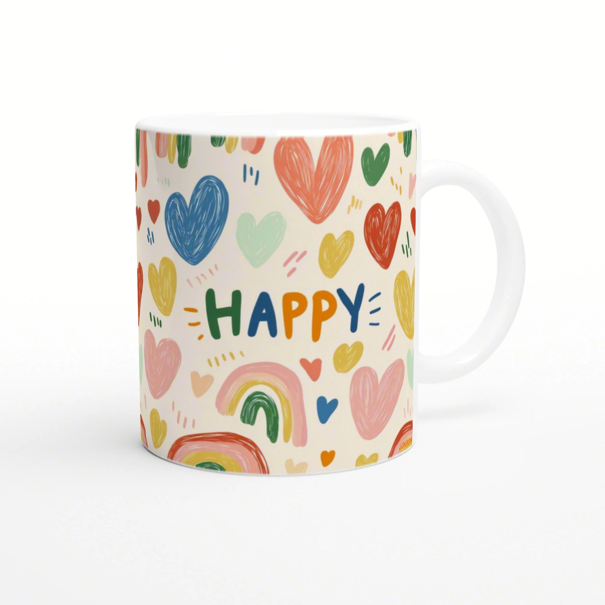White ceramic mug with a playful pattern of multicolored hearts and rainbows, with the word HAPPY in bright letters.