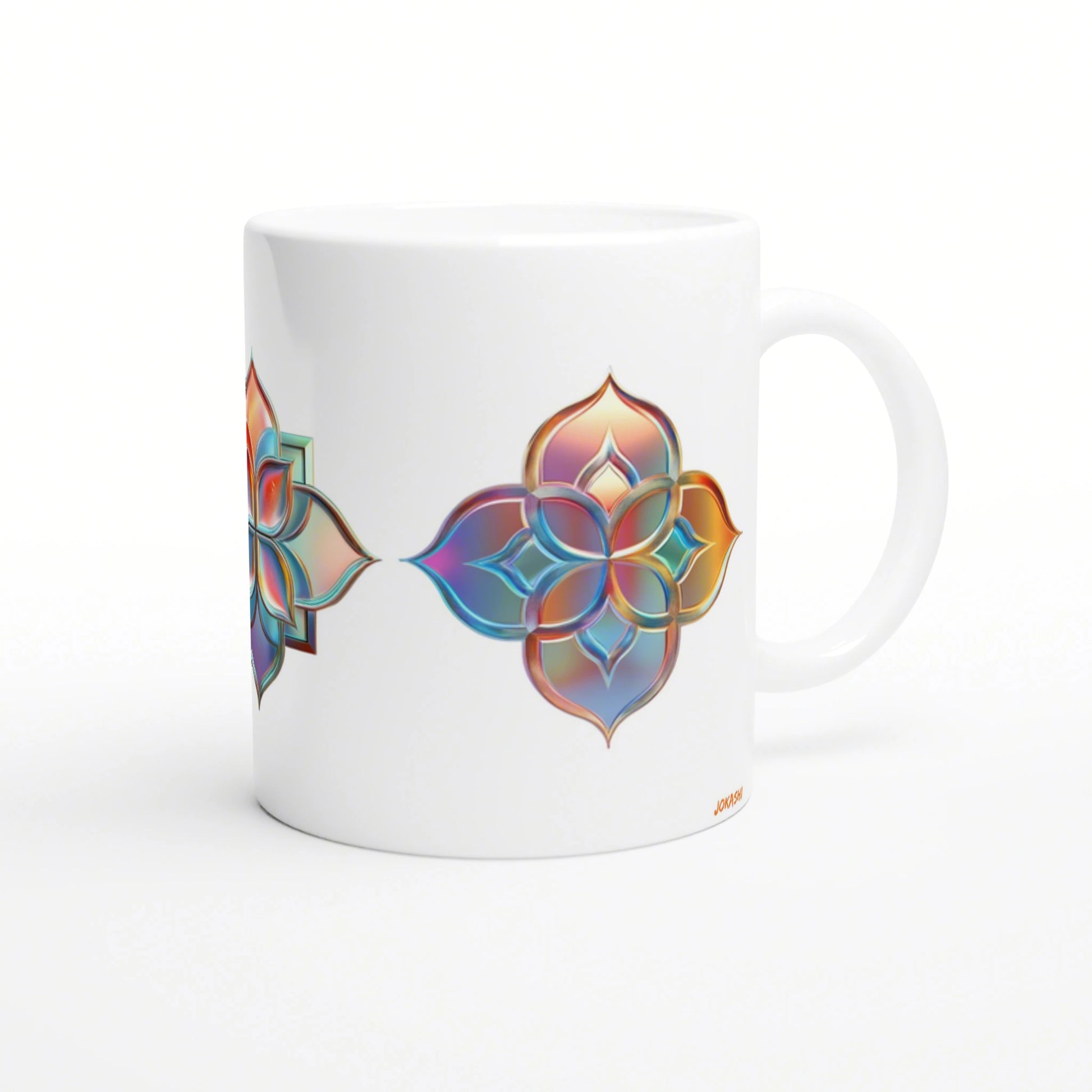 White ceramic mug on white background with a vibrant, multicolored mandala flower design along its side.