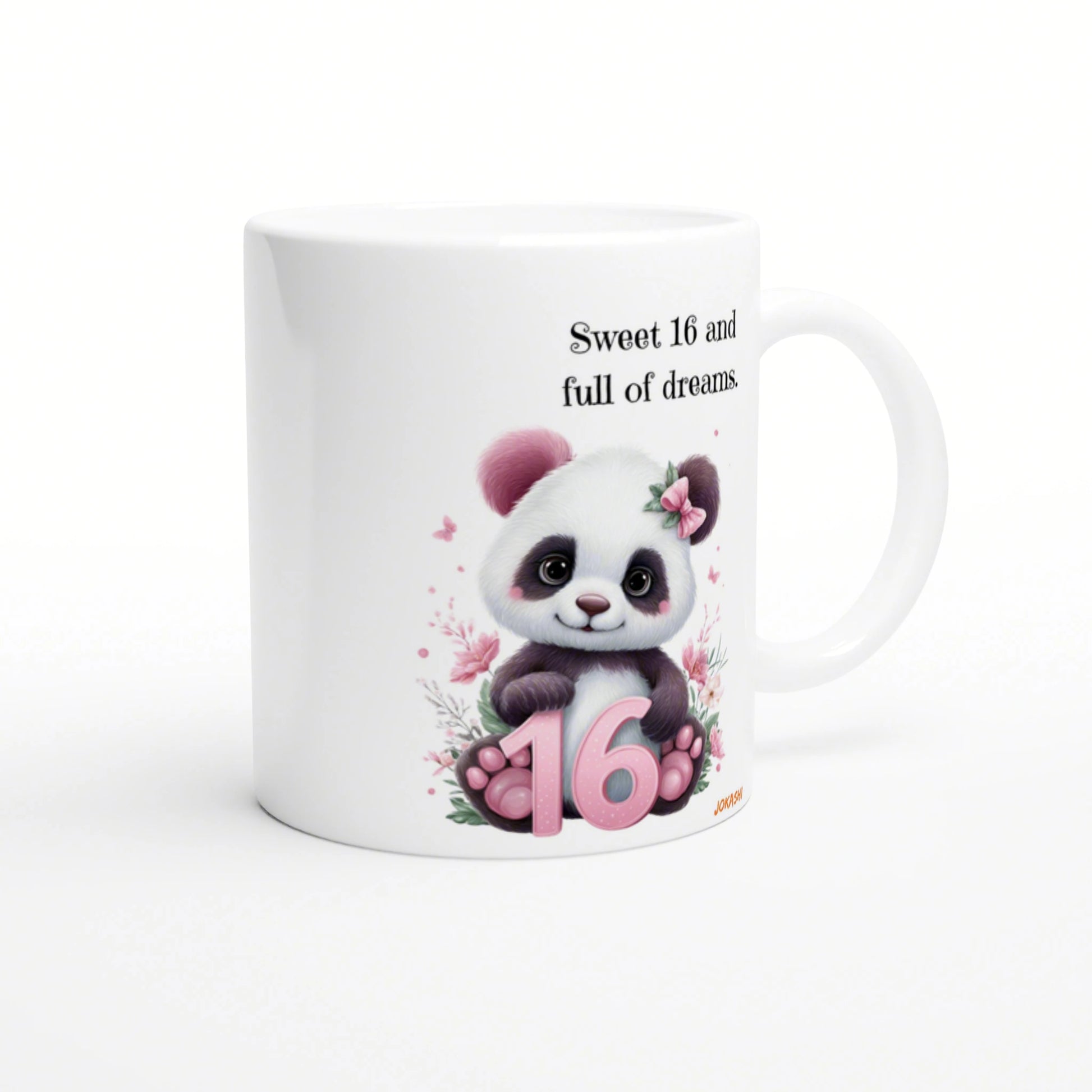 White ceramic mug with a cute panda, pink ears, floral accents, pink 16, and the phrase Sweet 16 and full of dreams.