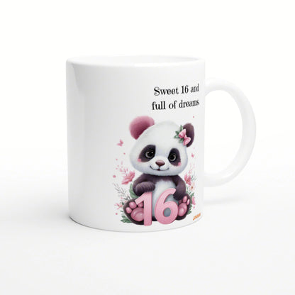 White ceramic mug with a cute panda, pink ears, floral accents, pink 16, and the phrase Sweet 16 and full of dreams.
