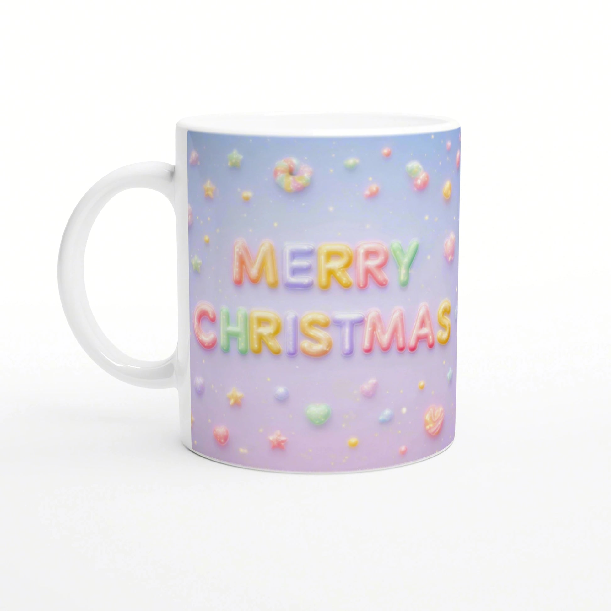 White ceramic mug with pastel gradient background and candy-like 'MERRY CHRISTMAS' lettering, surrounded by small colorful sweets.