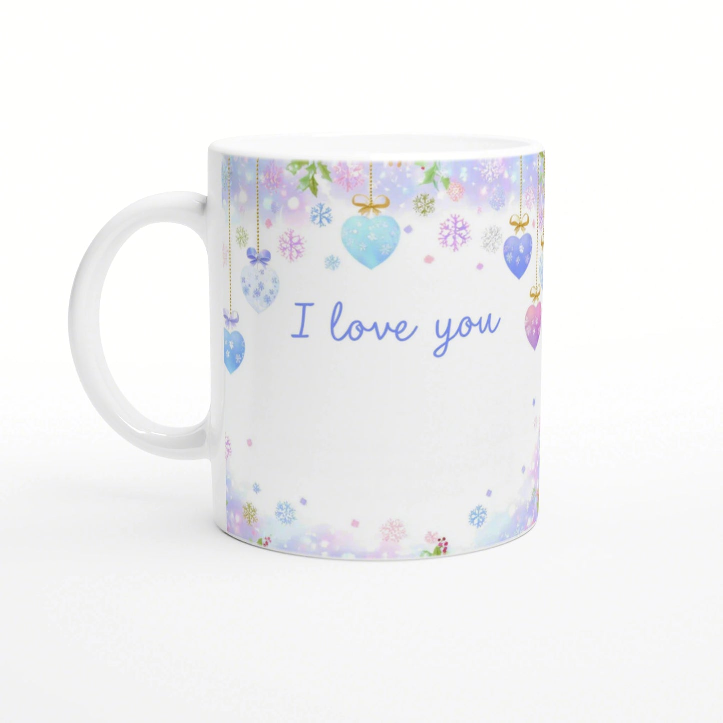 White ceramic mug with pastel hanging hearts and snowflakes and blue 'I love you' text; product mockup.
