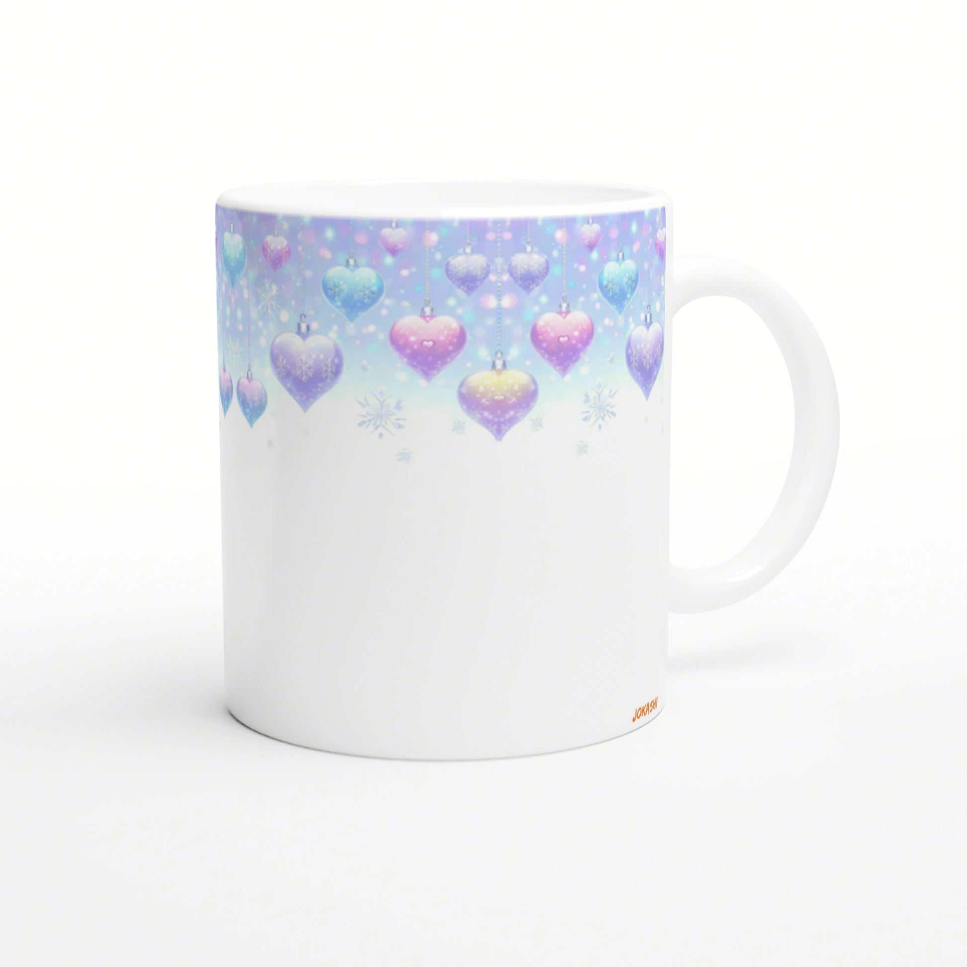 White ceramic mug mockup with pastel hanging hearts and snowflakes along a blue-to-pink gradient top.