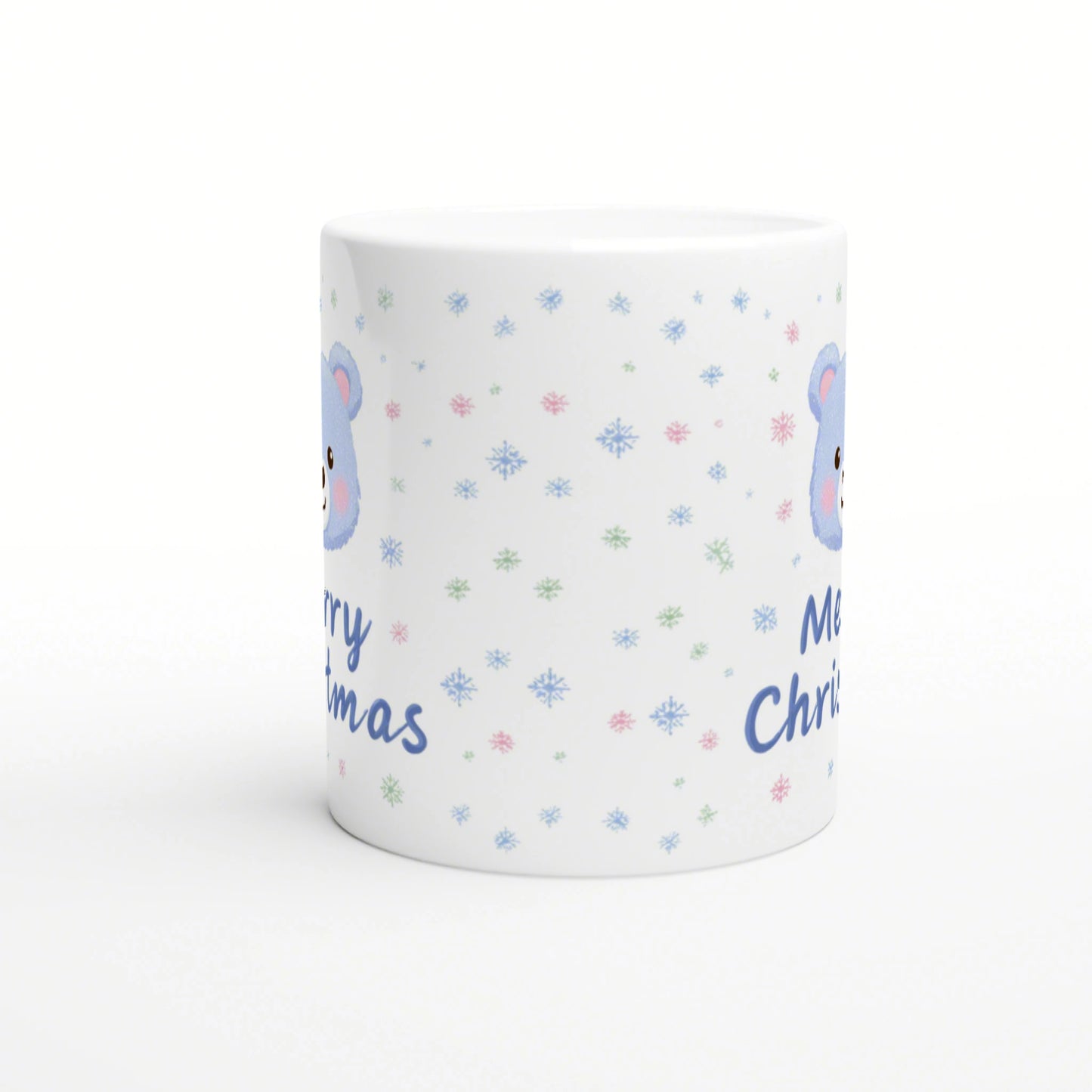 White ceramic mug mockup with pastel snowflakes, a blue bear illustration, and blue 'Merry Christmas' text.