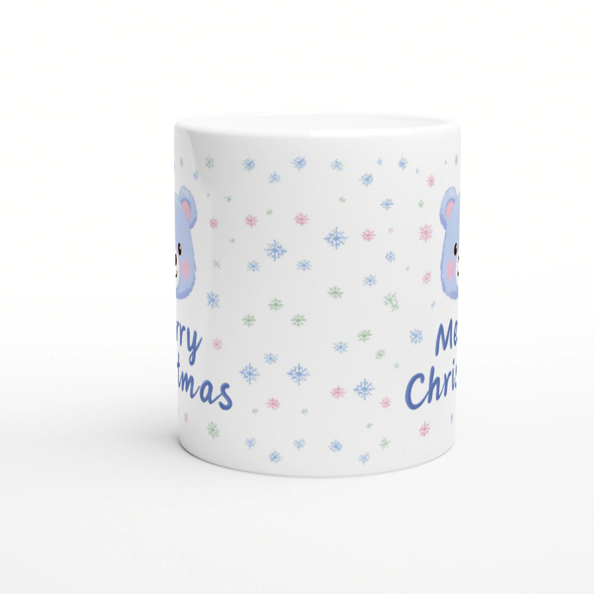 White ceramic mug mockup with pastel snowflakes, a blue bear illustration, and blue 'Merry Christmas' text.