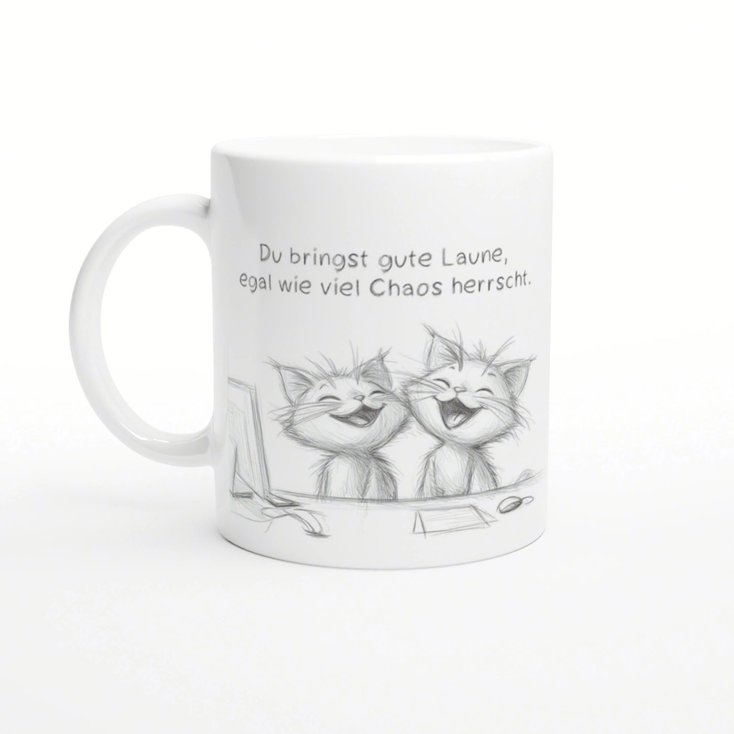 White ceramic mug featuring a pencil sketch of two laughing cats and a German caption about good mood despite chaos.