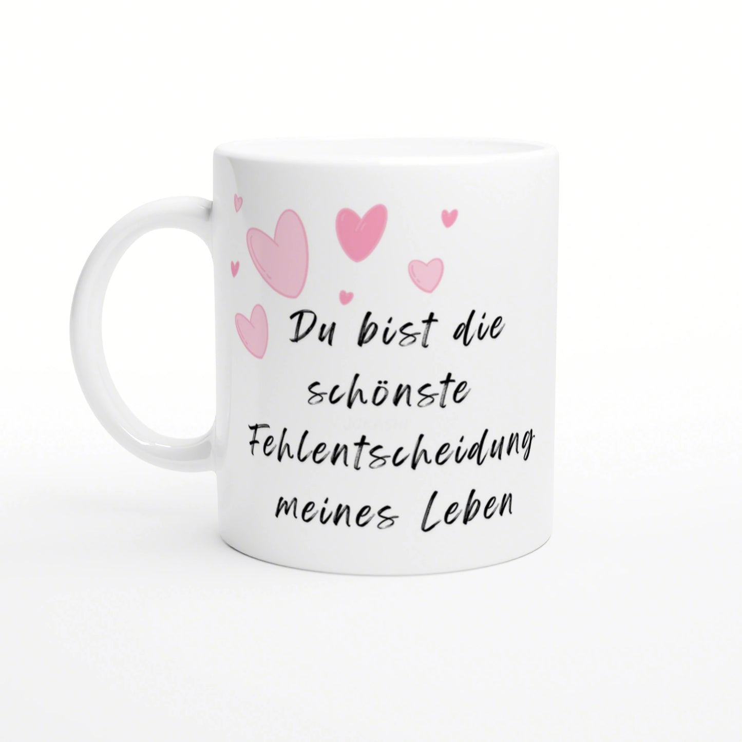 White ceramic mug with pink hearts and black cursive German text: Du bist die schönste Fehlentscheidung meines Lebens.