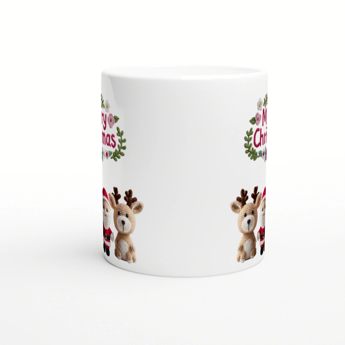 White ceramic mug product mockup with Christmas design: knitted-reindeer, Santa, green wreaths, and Merry Christmas.