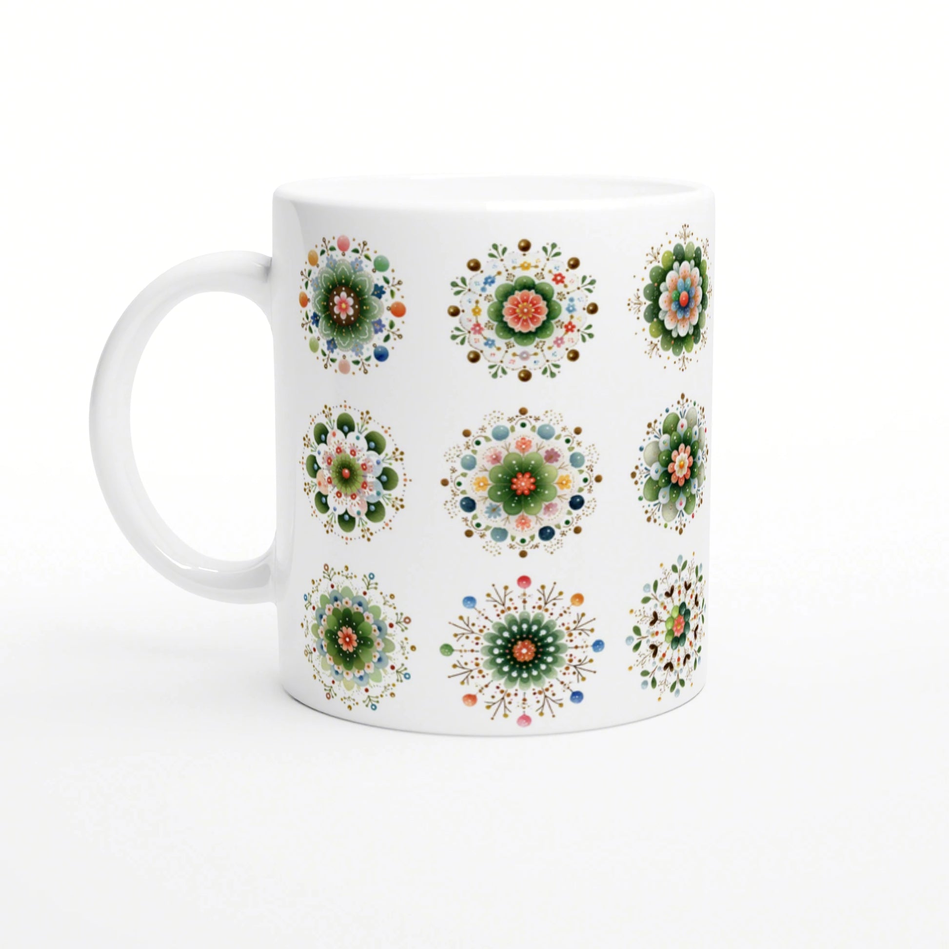 White ceramic mug with a repeating pattern of colorful mandala flower designs.