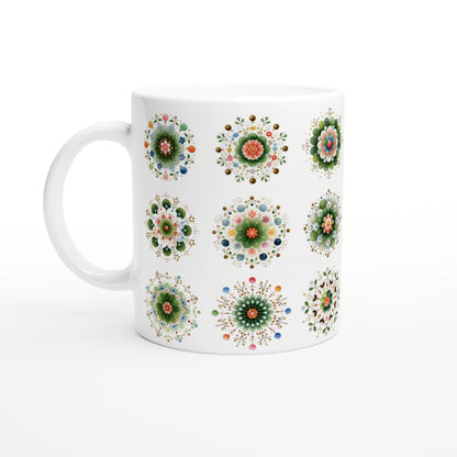 White ceramic mug with a repeating pattern of colorful mandala flower designs.