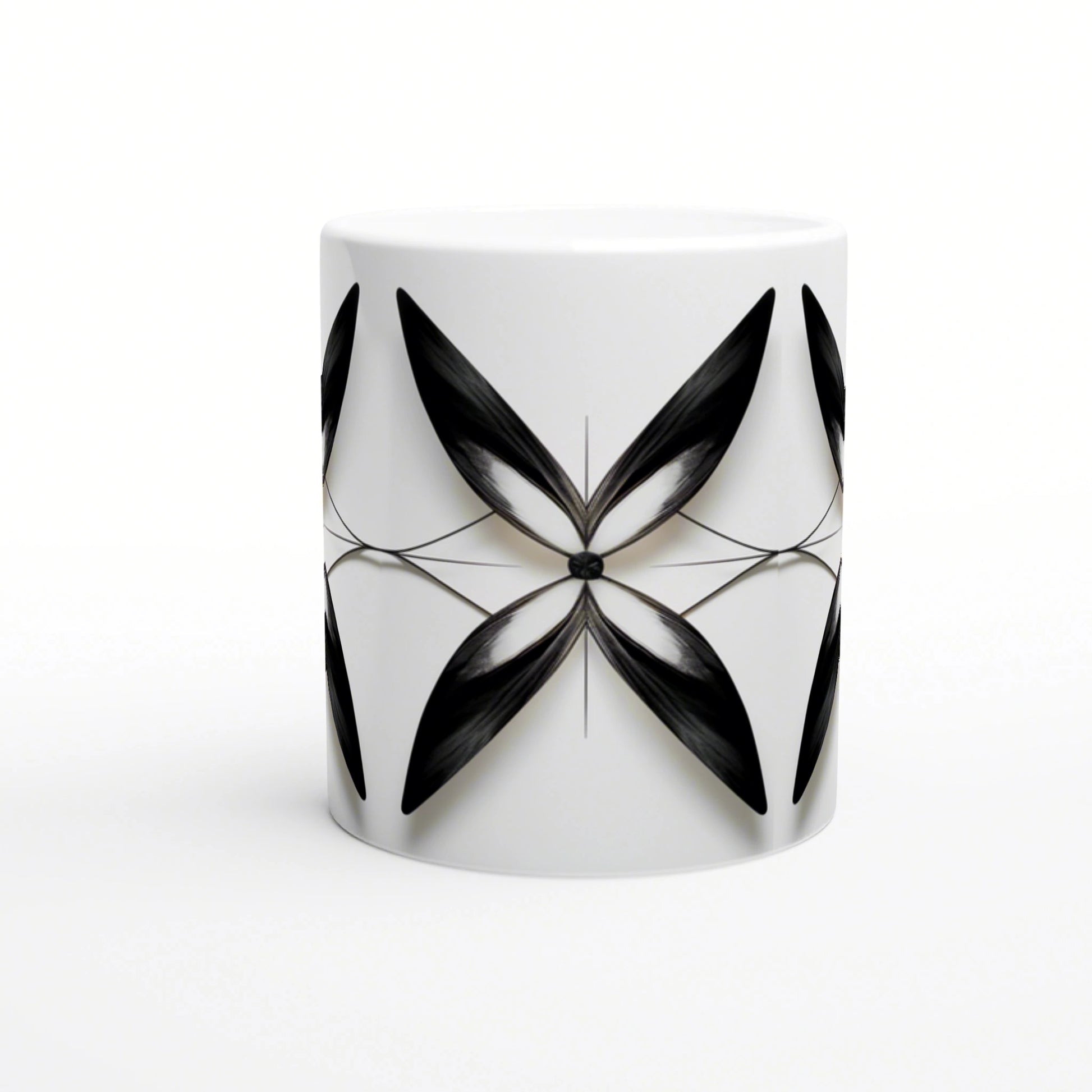 White ceramic mug with a symmetric black abstract floral motif radiating from a central point.