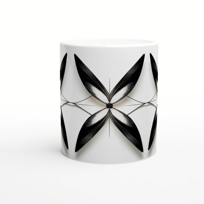 White ceramic mug with a symmetric black abstract floral motif radiating from a central point.