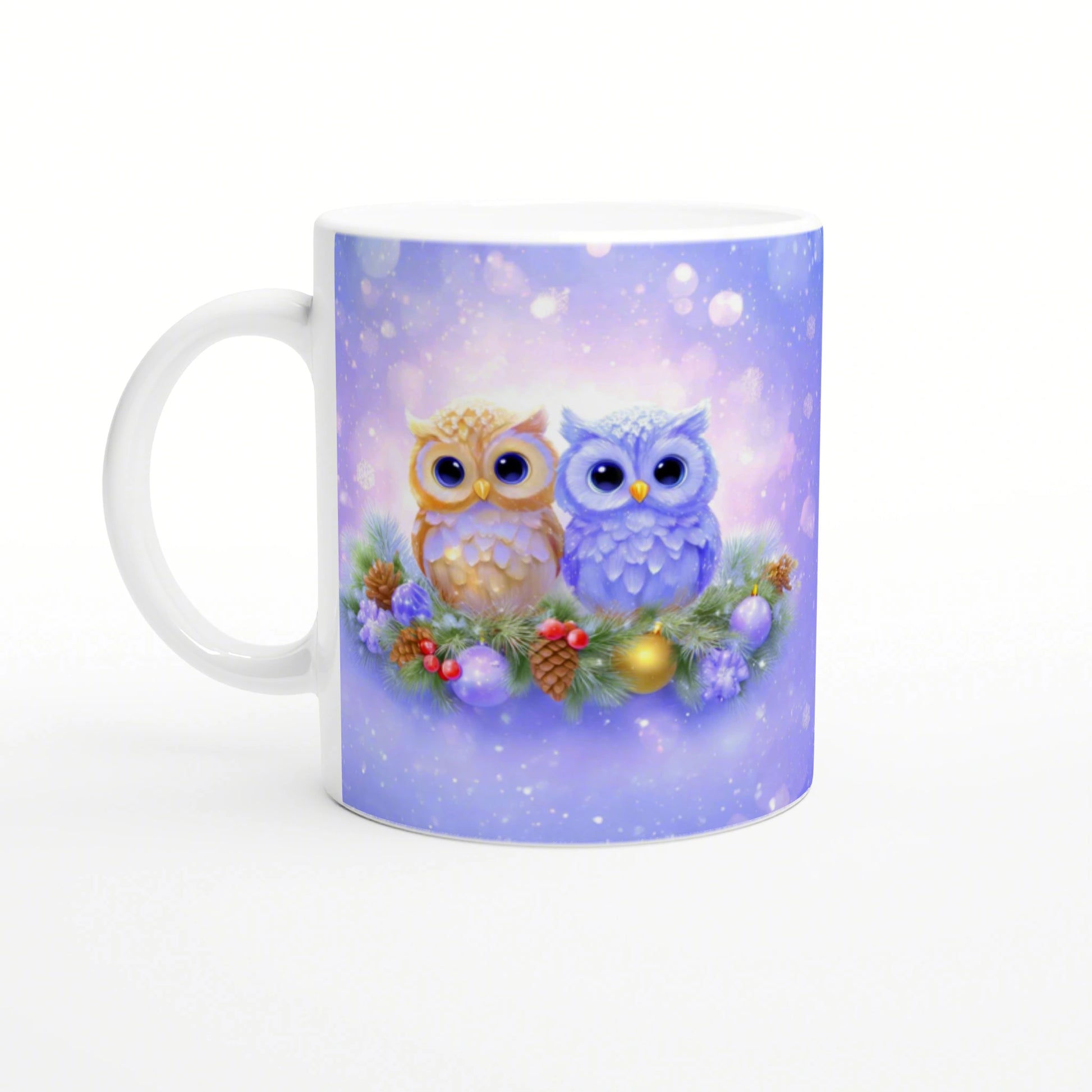 White ceramic mug with pastel purple winter scene: two cute owls perched on a festive wreath with pine cones and ornaments.