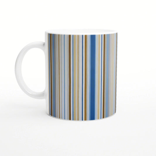 White ceramic mug on a white background with vertical multicolor stripes in blue, beige, and brown; product mockup.