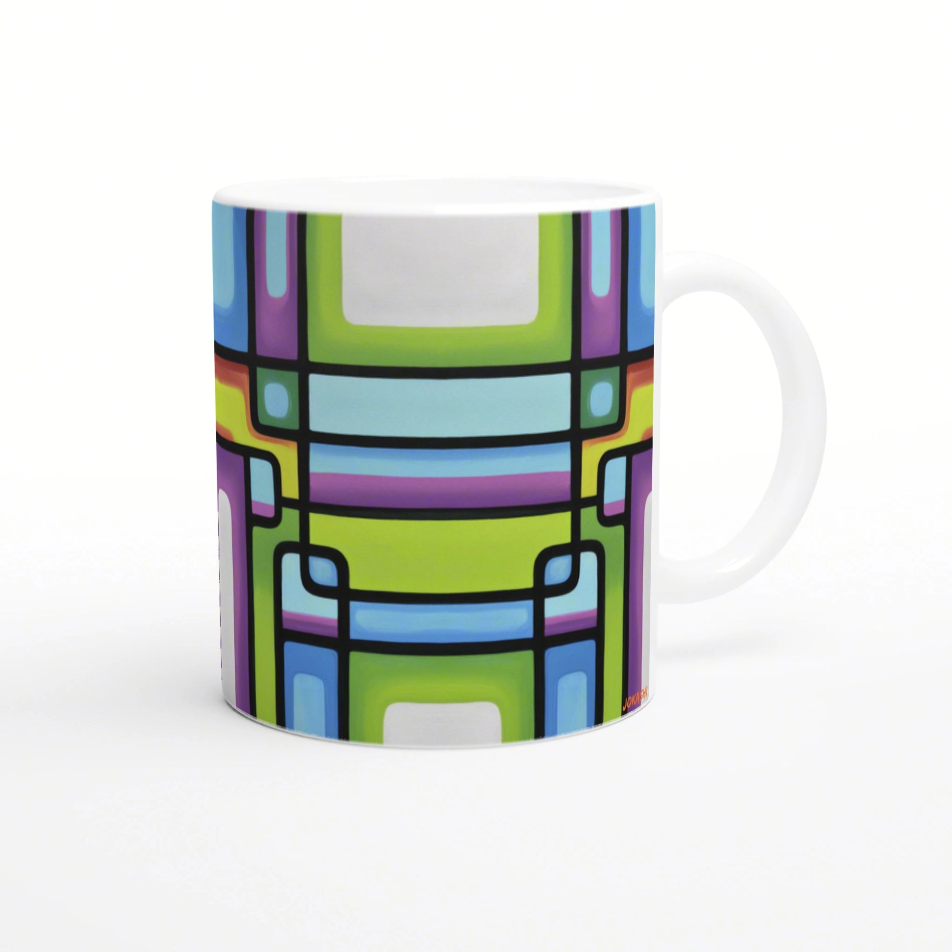 White ceramic mug with a vibrant abstract geometric pattern of rectangular shapes in lime green, blue, purple, and pink.