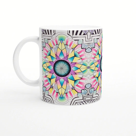 White ceramic mug with a vibrant multi-colored mandala design in teal, pink and yellow; black geometric border.