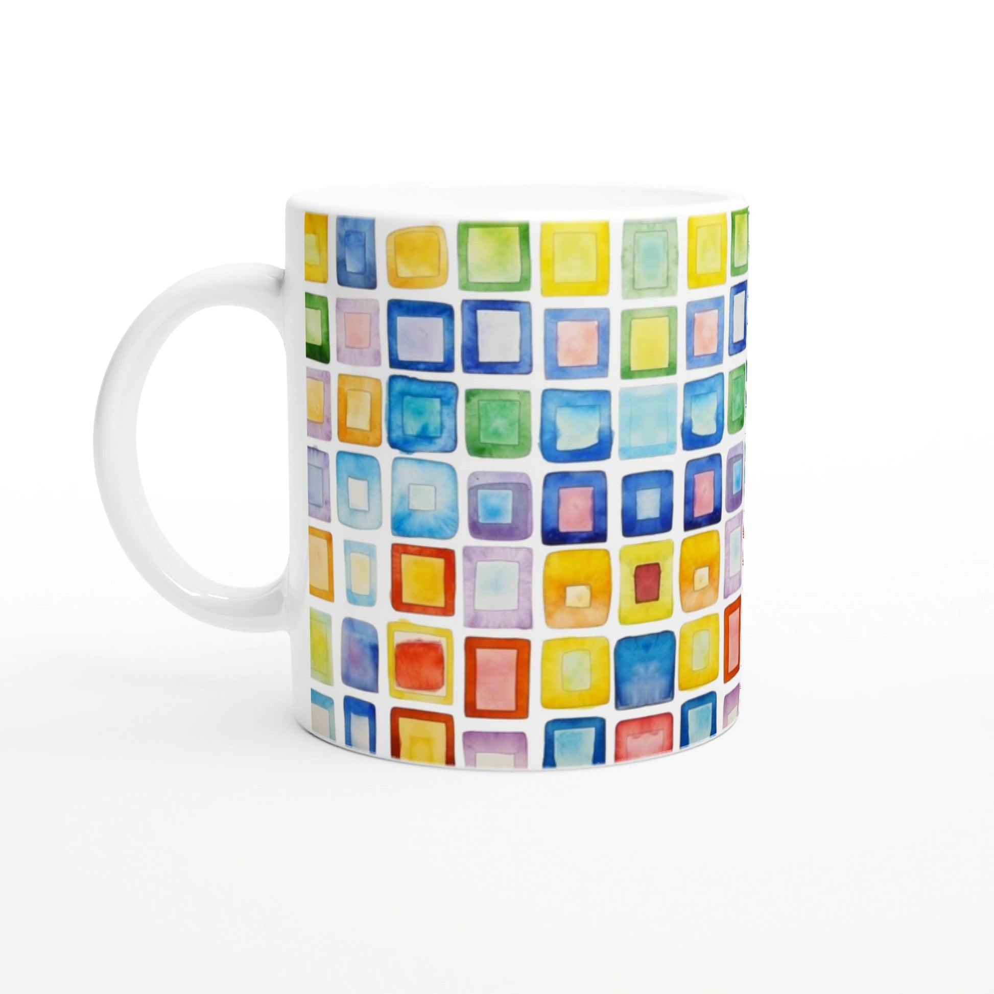 White ceramic mug featuring a vibrant watercolor grid of multicolored squares.