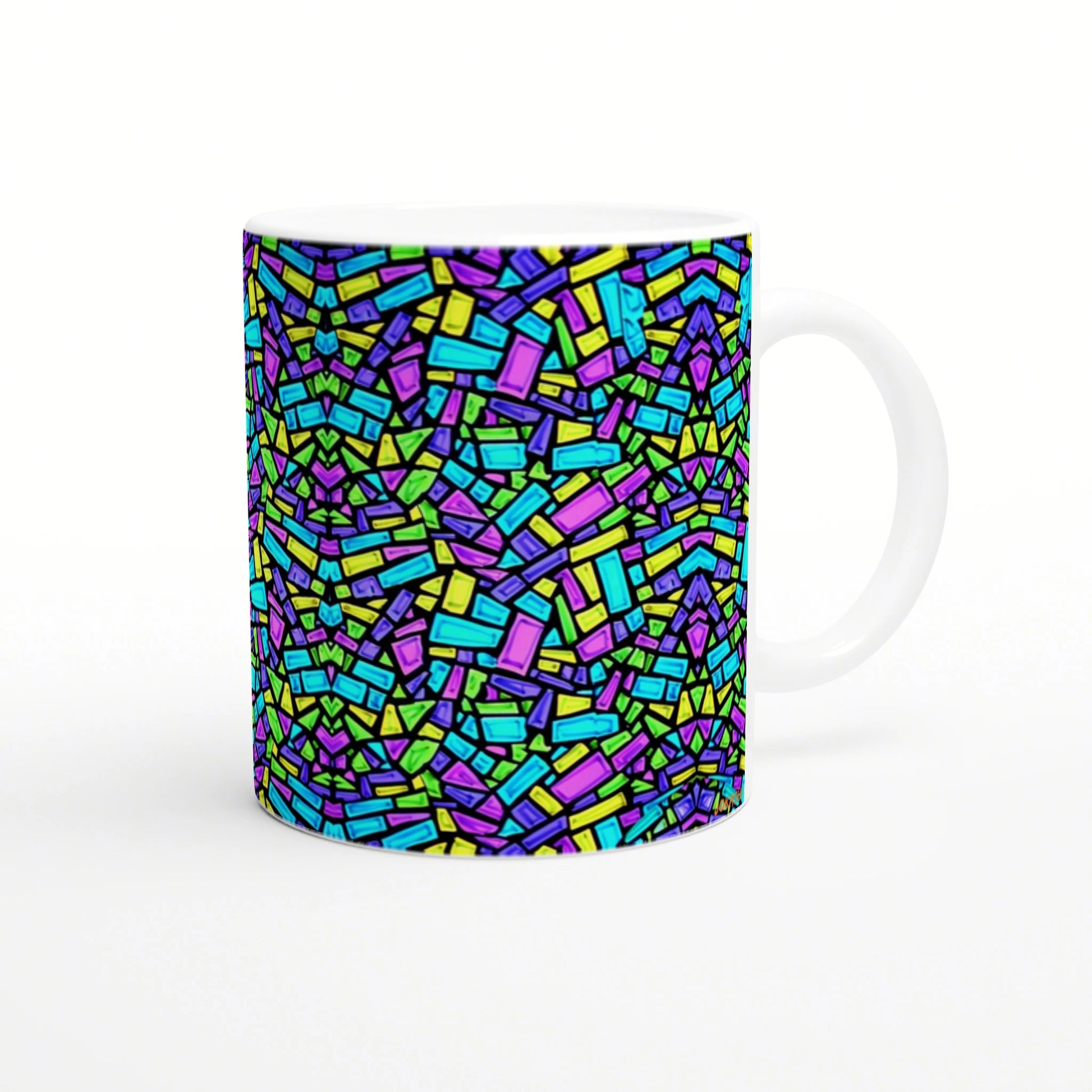 White ceramic mug with a vivid abstract mosaic of neon blue, green, yellow and purple rectangular shapes.