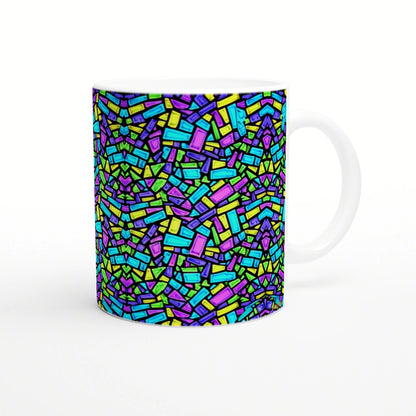 White ceramic mug with a vivid abstract mosaic of neon blue, green, yellow and purple rectangular shapes.