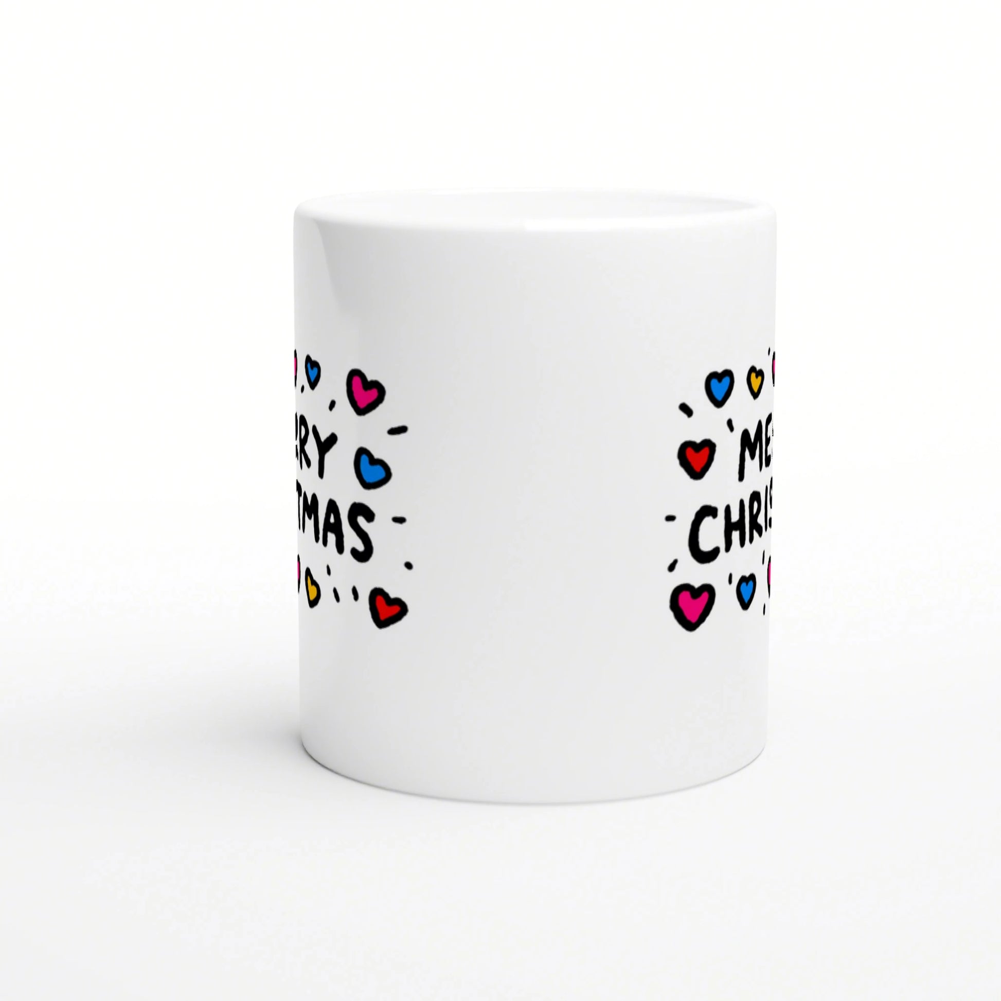 White ceramic mug with a wraparound doodle-style 'Merry Christmas' text and colorful hearts.