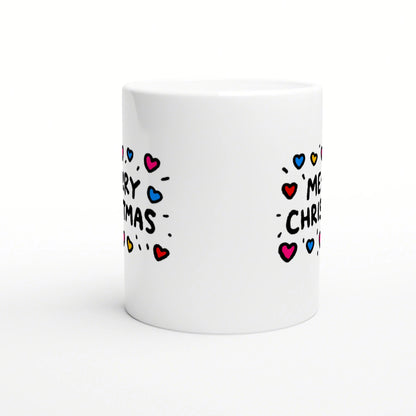 White ceramic mug with a wraparound doodle-style 'Merry Christmas' text and colorful hearts.
