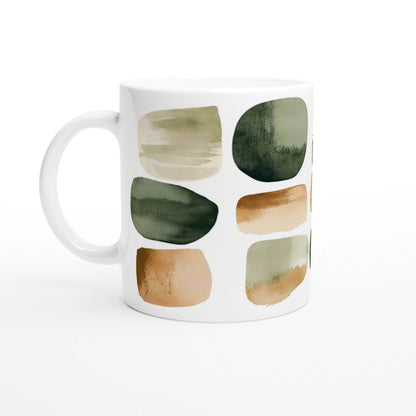 White mug with abstract watercolor blocks in earthy olive, beige, and peach tones (product mockup).