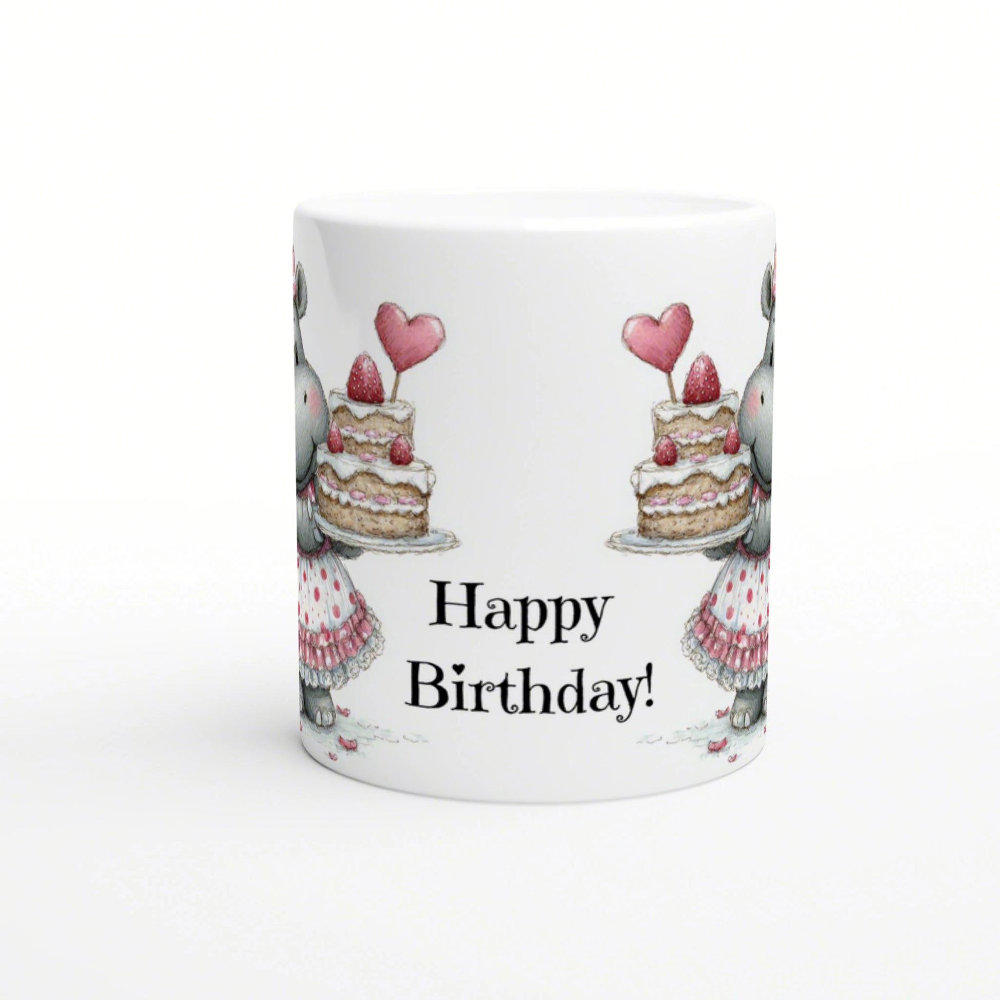 White mug featuring a birthday-themed illustration: two rabbits with cake on both sides, pink hearts, and Happy Birthday!