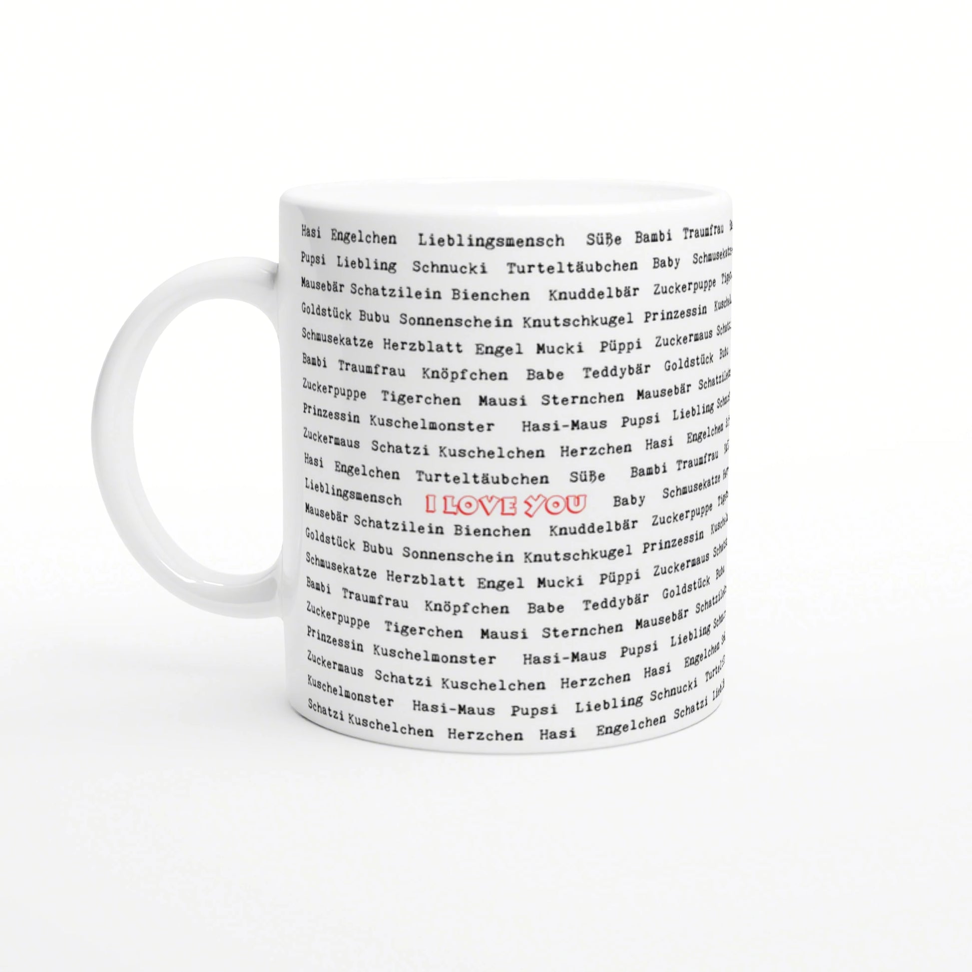 White ceramic mug with a black repeating German word pattern and a centered red 'I LOVE YOU'.