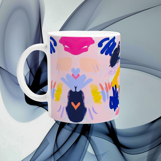 White mug with bright pink abstract design and symmetric blue, orange, and yellow shapes; product mockup.