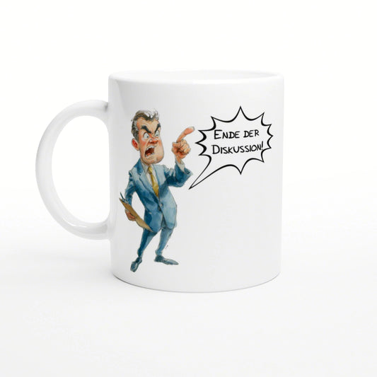 White mug featuring a cartoon caricature of an angry man in a blue suit, pointing and shouting 'Ende der Diskussion!'