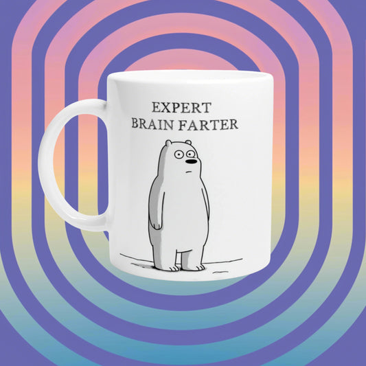 White mug featuring a cartoon bear and the text EXPERT BRAIN FARTER, set against a pastel rainbow spiral backdrop.