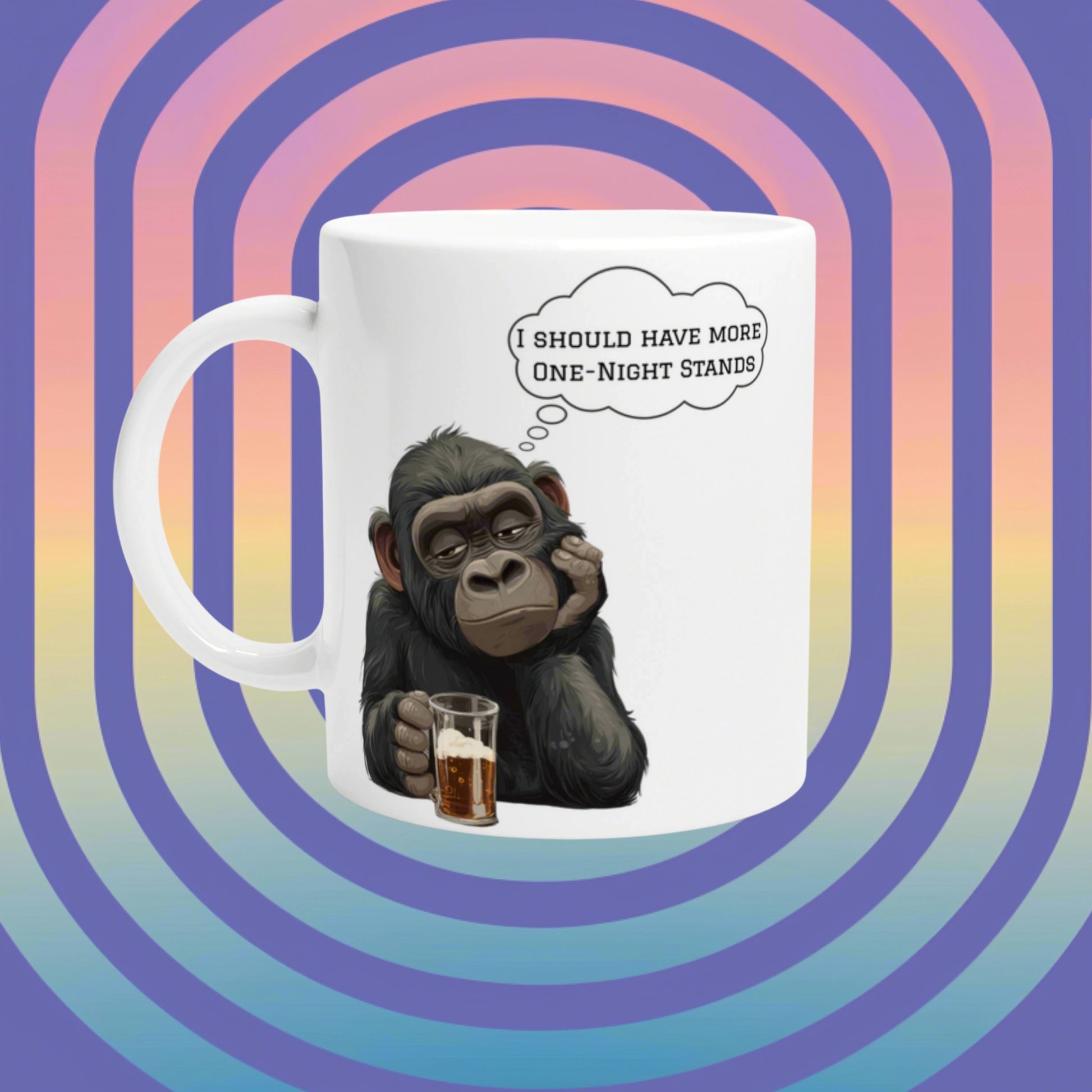 White mug with a cartoon chimp holding a beer and thinking 'I should have more one-night stands' against a retro rainbow background.