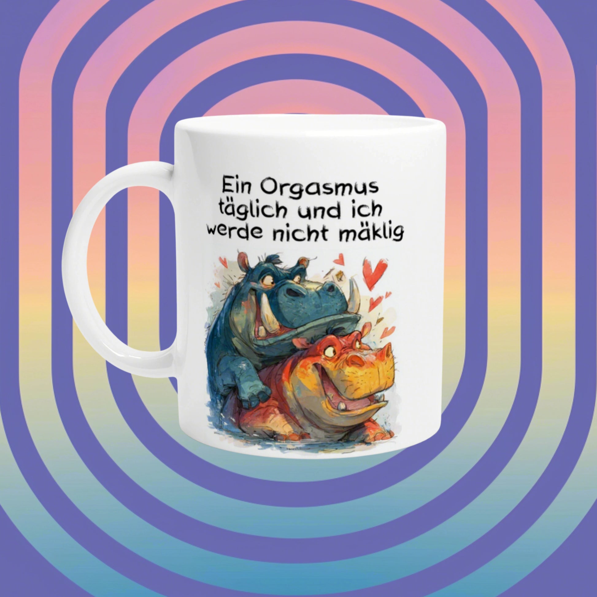 White mug with a cartoon of hippos and hearts and a German humorous slogan about orgasms, set against a pastel spiral background.