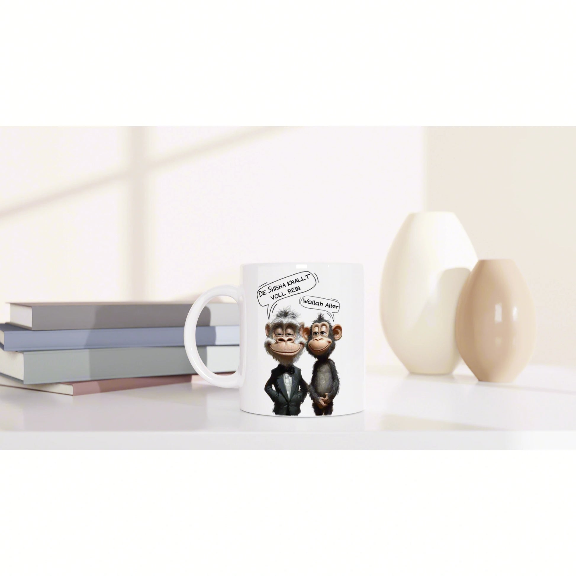 White mug featuring cartoon monkeys in suits with speech bubbles; humorous slogans on a desk beside books and decorative vases.