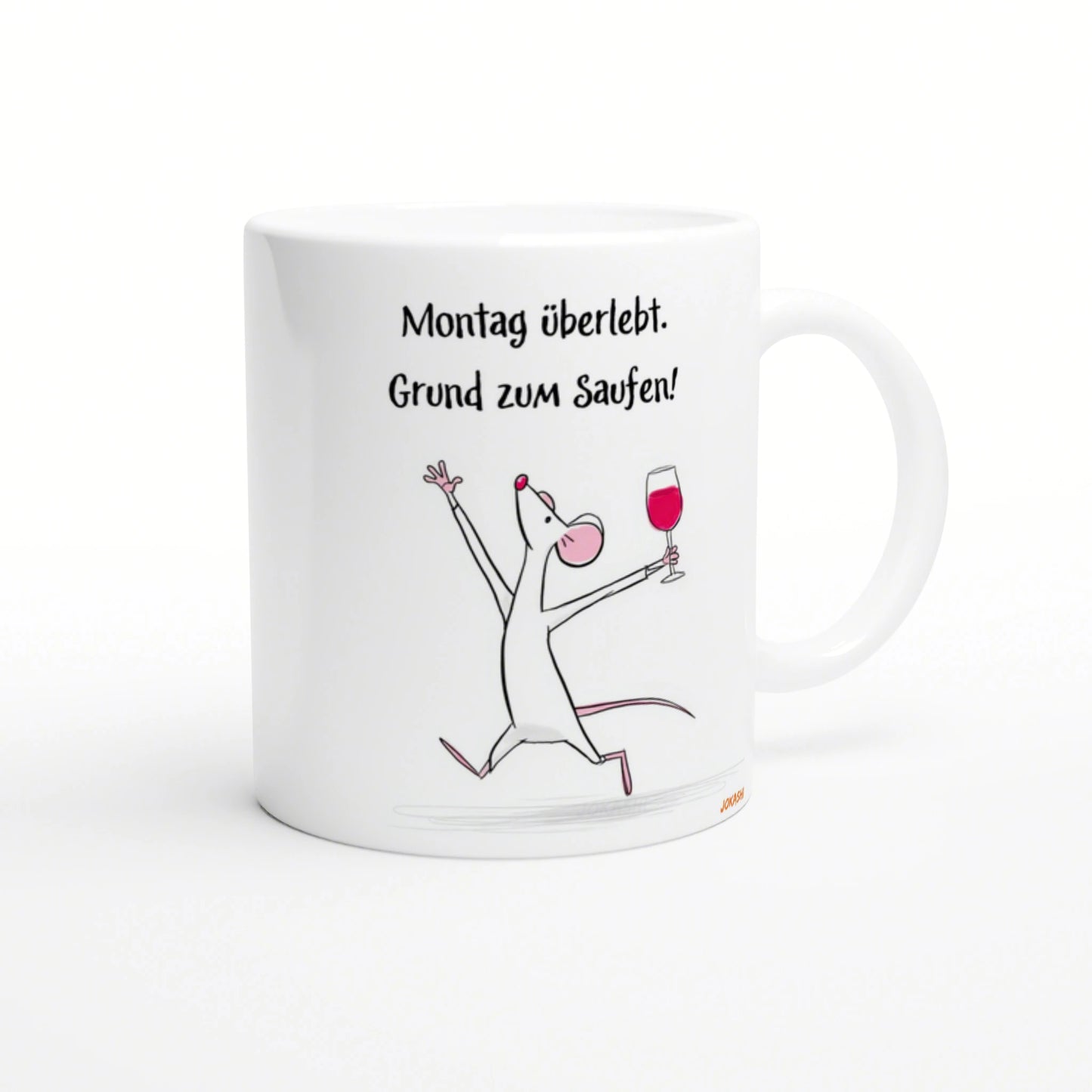 White mug with a cartoon mouse raising a wine glass and the German slogan 'Montag überlebt. Grund zum Saufen!'.