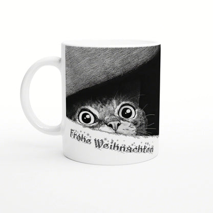 White ceramic mug featuring a black-and-white cat peeking from under a grey hat with the text Frohe Weihnachten.