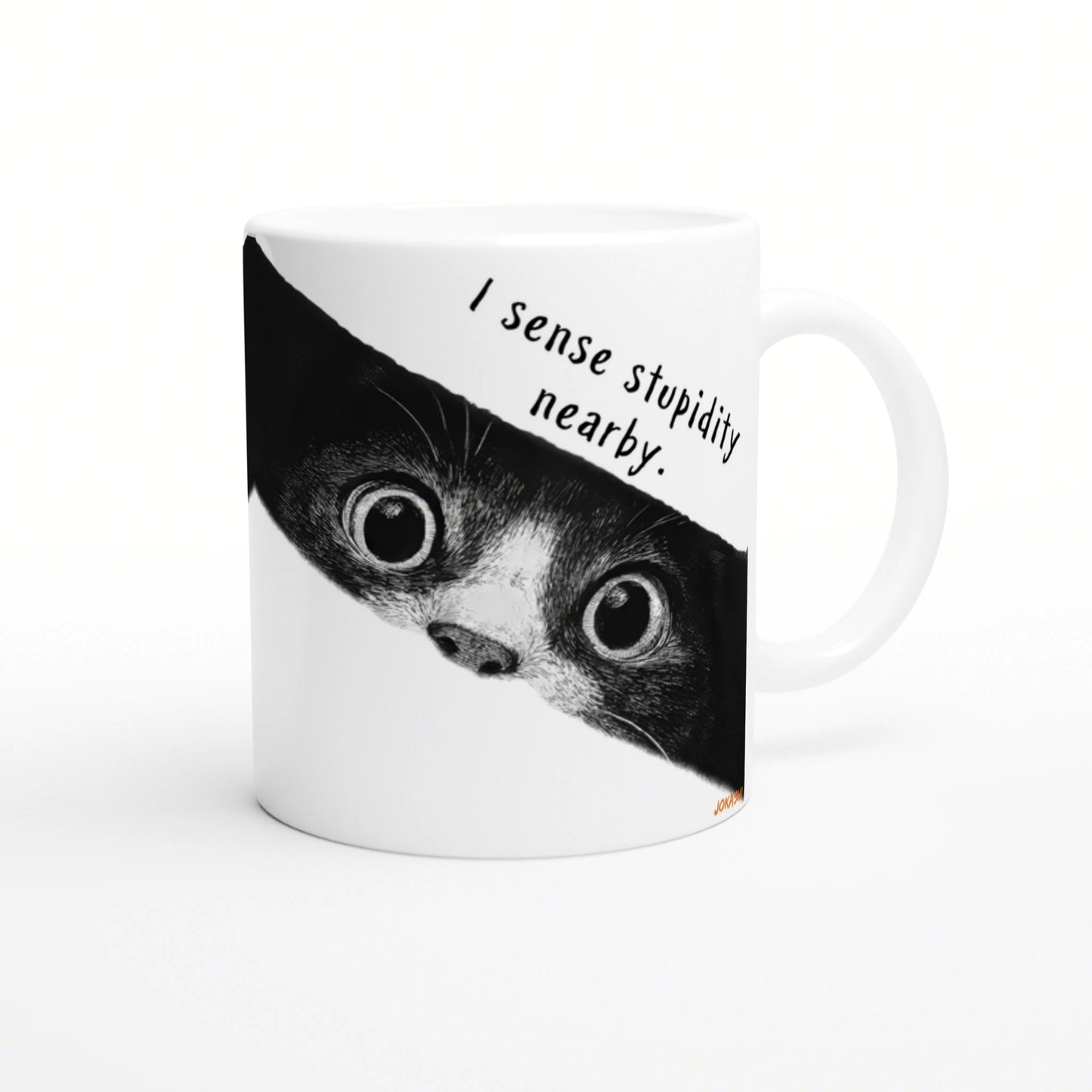 White ceramic mug with a black-and-white cat peeking from the edge and the caption 'I sense stupidity nearby'.