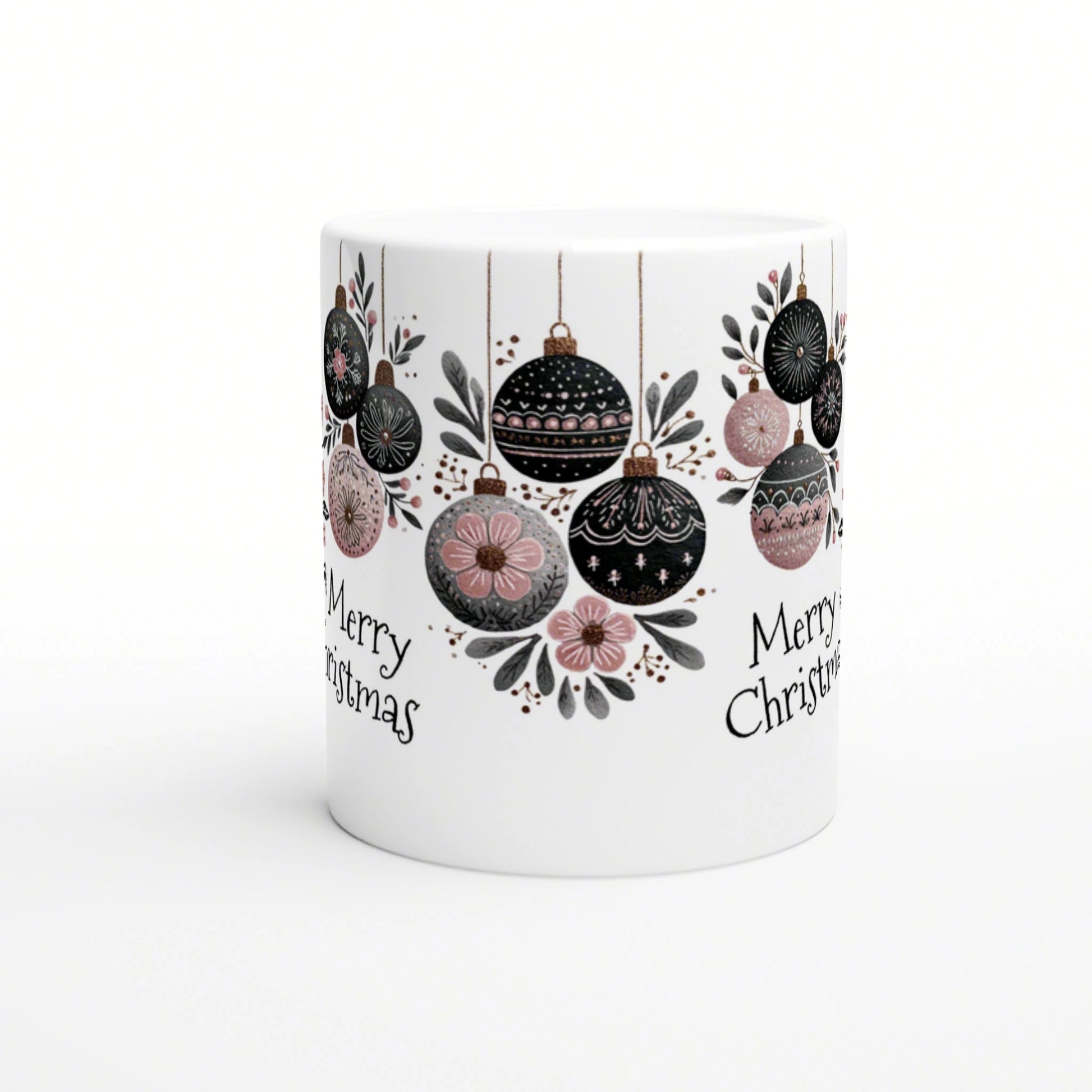 White mug featuring a Christmas ornament motif with hanging black, pink, and gray baubles and 'Merry Christmas' text.