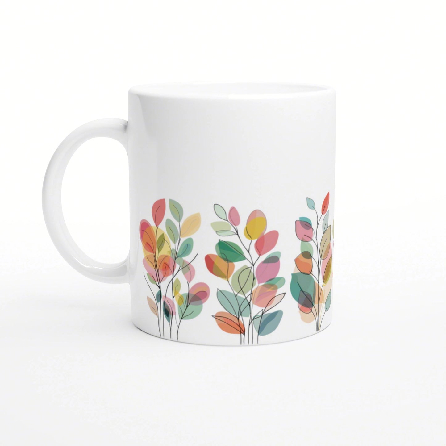 White ceramic mug featuring a colorful abstract leaf pattern along the bottom edge.