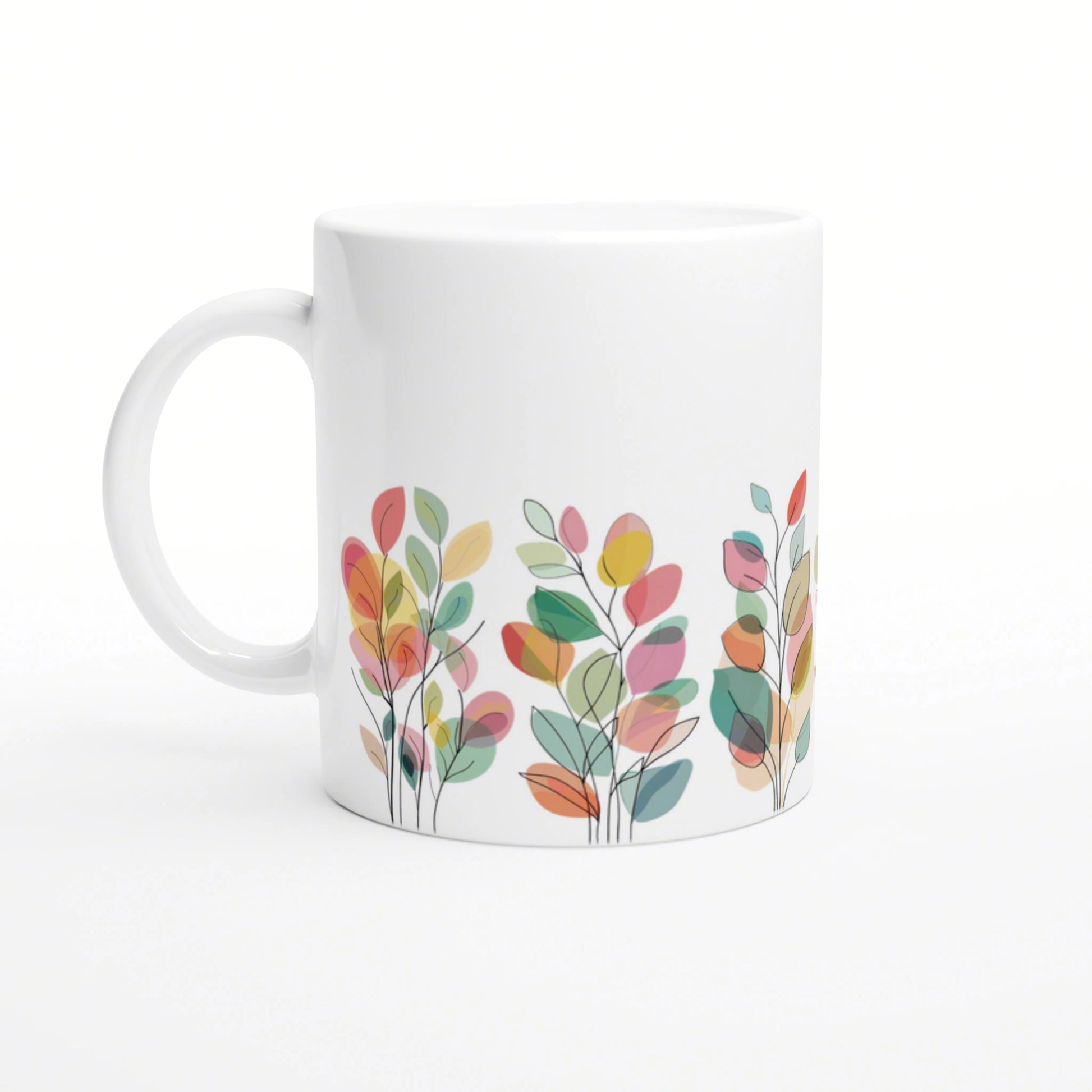 White ceramic mug featuring a colorful abstract leaf pattern along the bottom edge.