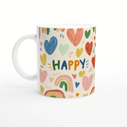 White mug covered in colorful hearts and rainbows, with the word HAPPY in multicolored letters; product mockup.