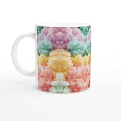 White ceramic mug wrapped in a vibrant kaleidoscopic pattern of pink, yellow, green, and teal cloud-like shapes.
