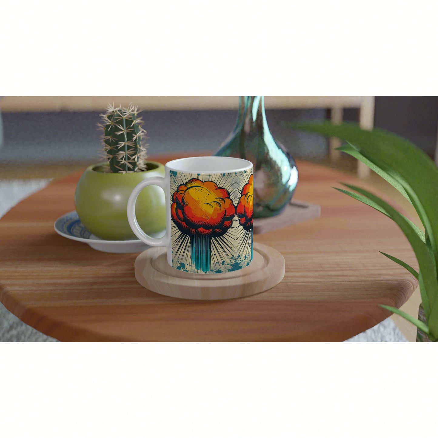 White mug mockup with bold comic-style orange explosion design on a wooden coaster, beside a cactus and teal vase.